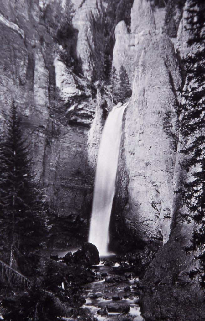 William Henry Jackson photo showing boulder at edge of Tower Falls